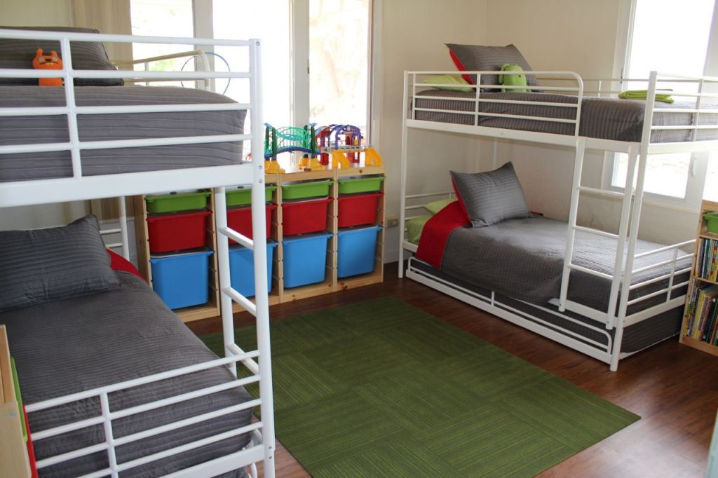 three bunk beds in one room